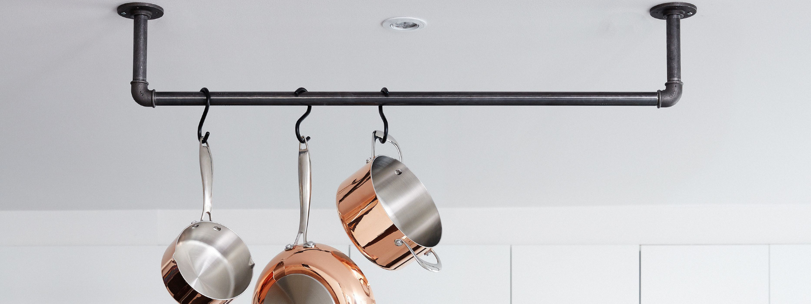 Wall- and ceiling-mounted clothes rails